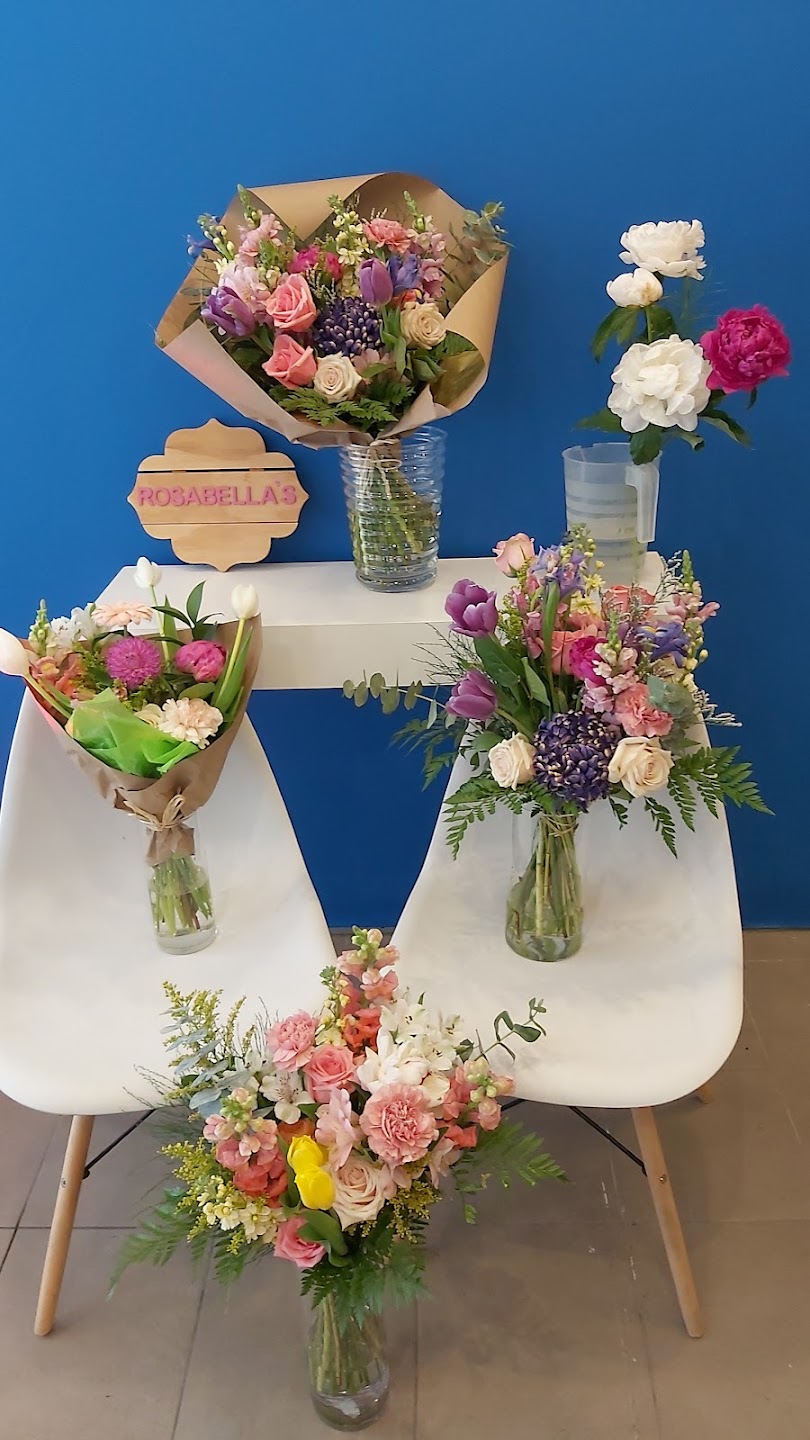 Colorful bouquets arranged on white chairs