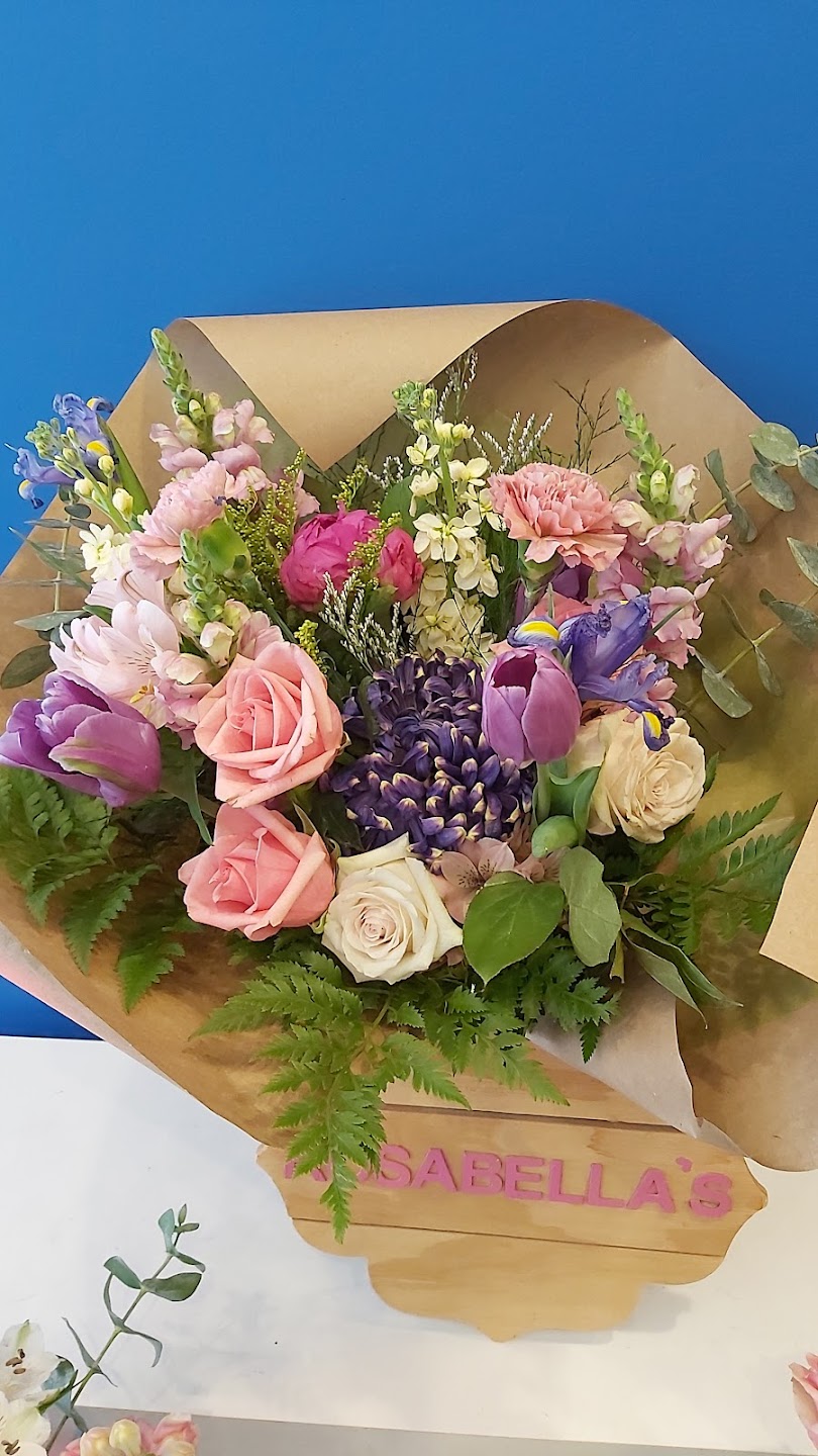Pastel bouquet wrapped in kraft paper with Rosabella branding